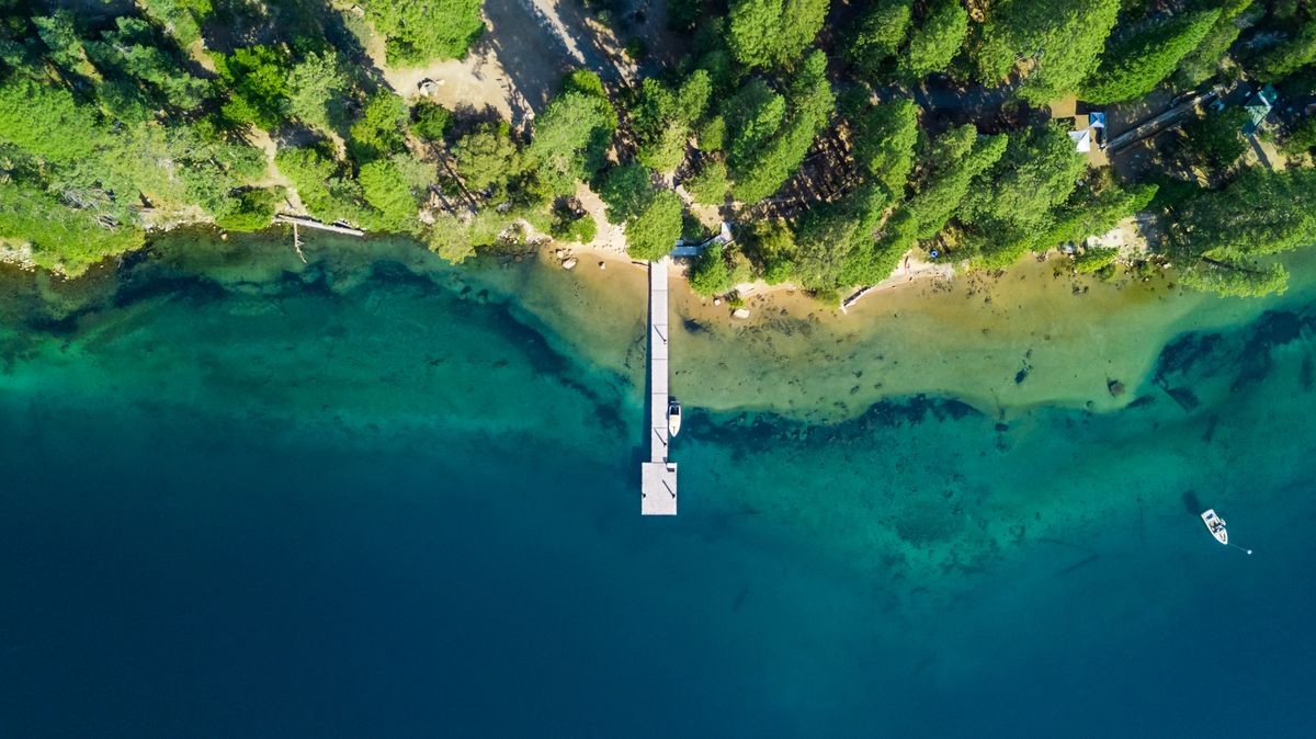 	
Drone view of the shore with a pontoon at Lake Tahoe California